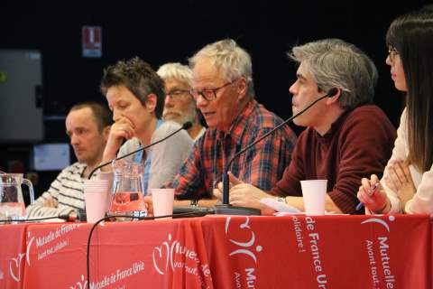 a group of people sitting at a table